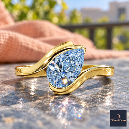 Blue Pear Cut Lab Grown Diamond Engagement Ring - Wrap Bypass Solitaire in yellow gold, close-up