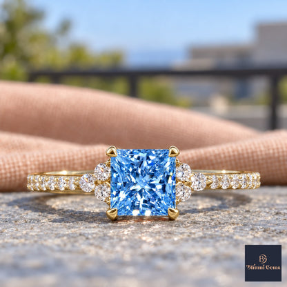 Blue Princess Cut Lab Grown Diamond Engagement Ring - Cluster Pave Band in yellow gold, close-up