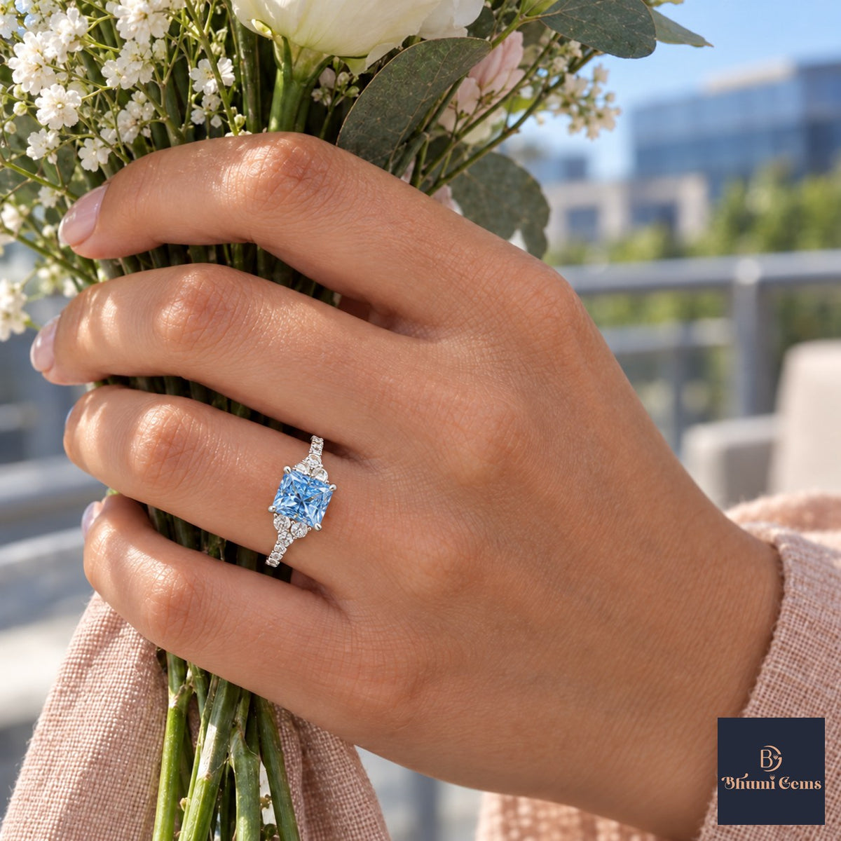 Blue Princess Cut Lab Grown Diamond Engagement Ring - Cluster Pave Band in white gold, on the hand