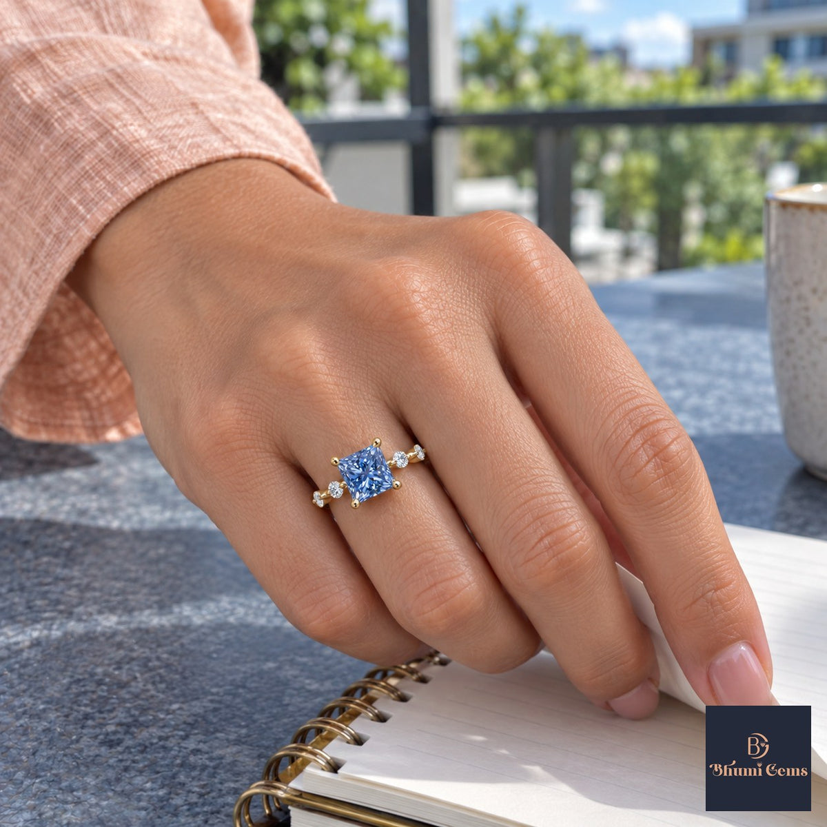 Blue Princess Cut Lab Grown Diamond Engagement Ring - Station Band in yellow gold, on the hand