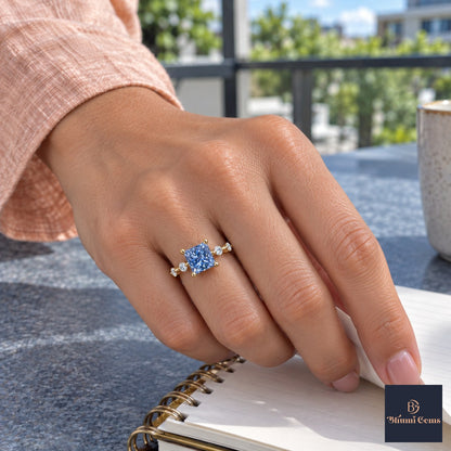Blue Princess Cut Lab Grown Diamond Engagement Ring - Station Band in yellow gold, on the hand