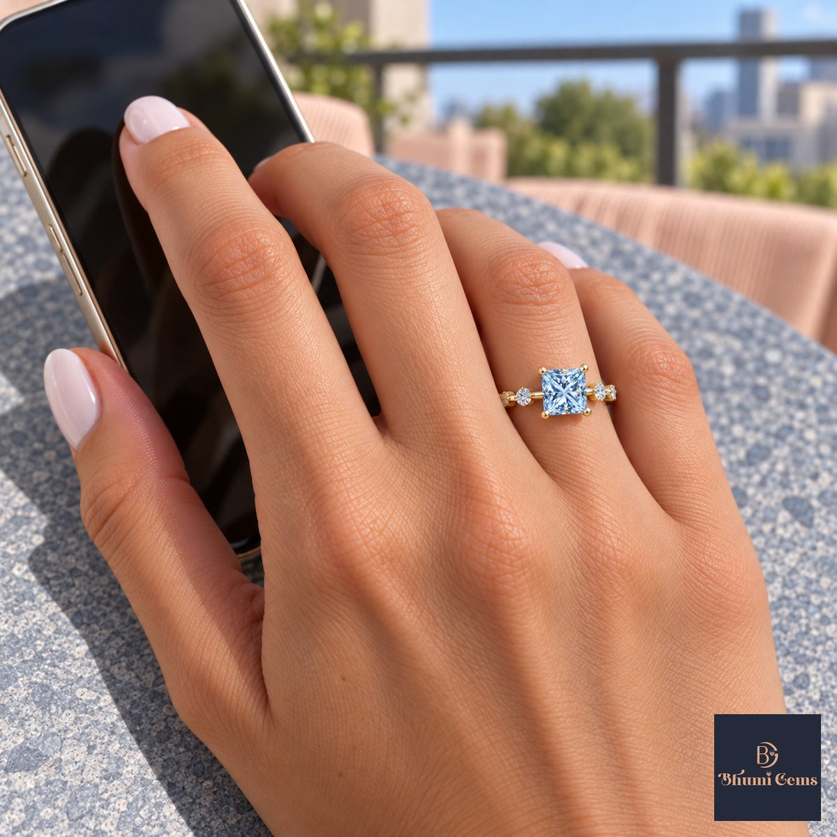 Blue Princess Cut Lab Grown Diamond Engagement Ring - Station Band in yellow gold, worn on the hand