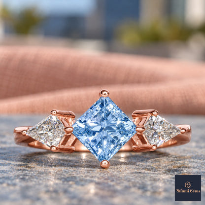 Blue Princess Cut Lab Grown Diamond Engagement Ring - Trillion Three Stone in rose gold, close-up