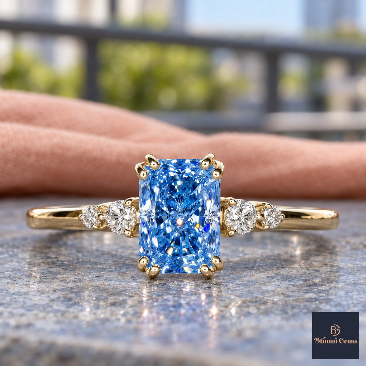 Blue Radiant Cut Lab Grown Diamond Engagement Ring - Round Accents in yellow gold, close-up