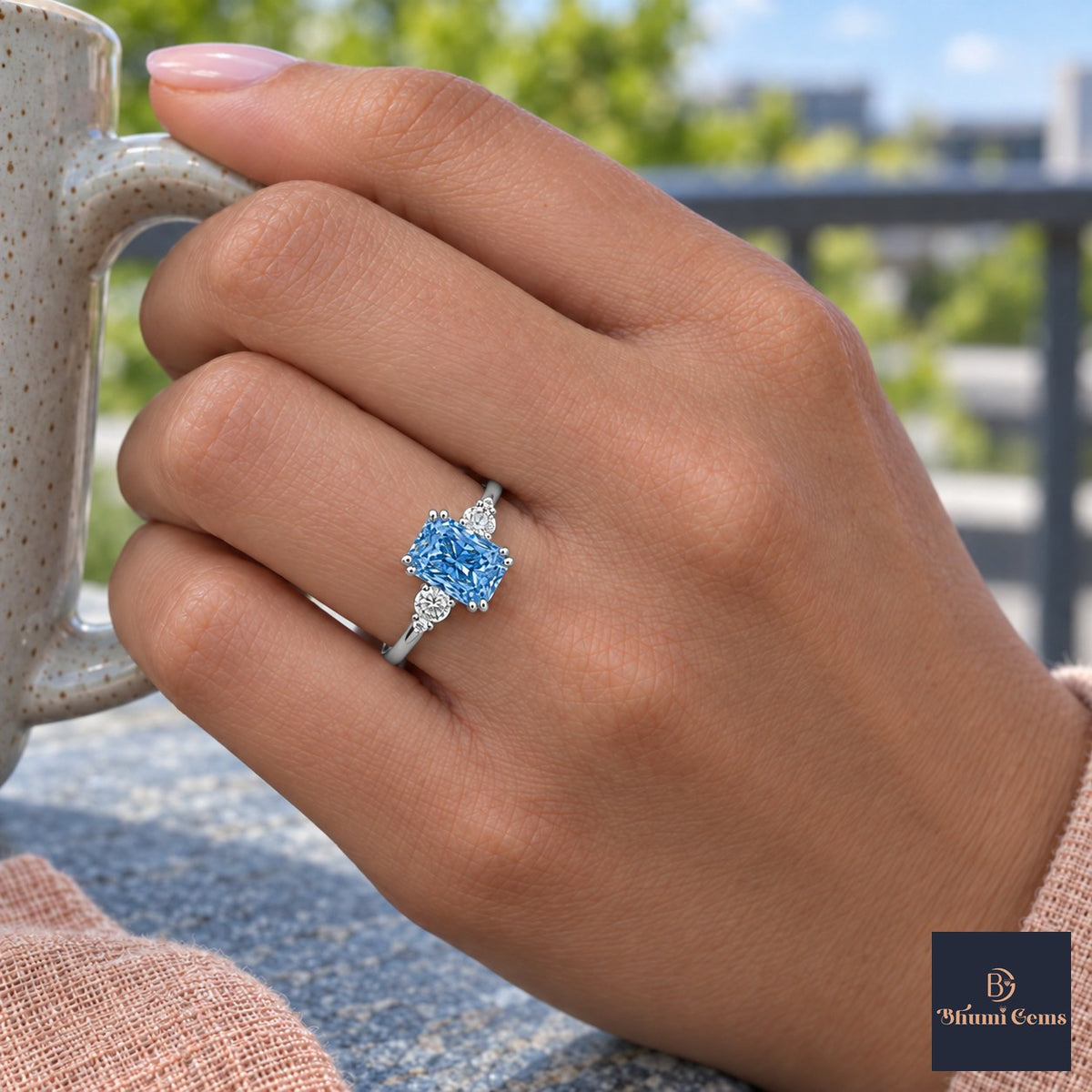 Blue Radiant Cut Lab Grown Diamond Engagement Ring - Round Accents in white gold, on the hand