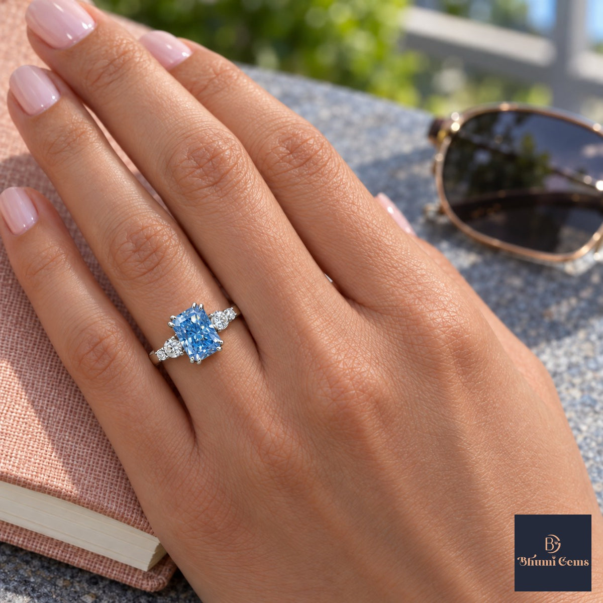 Blue Radiant Cut Lab Grown Diamond Engagement Ring - Round Accents in white gold, worn on the hand