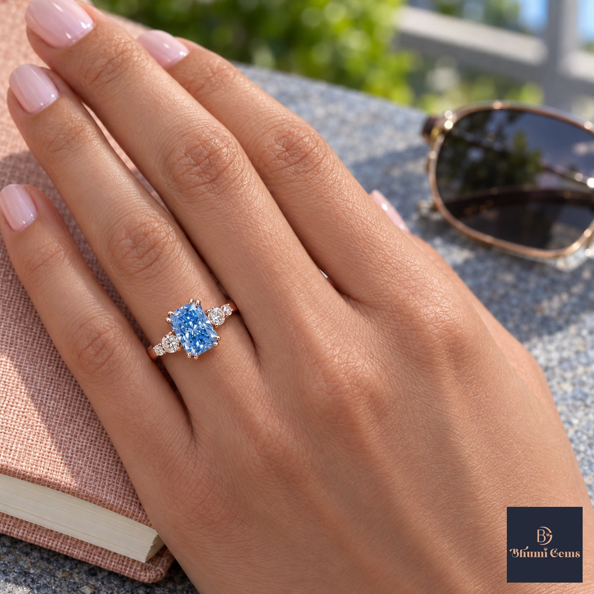 Blue Radiant Cut Lab Grown Diamond Engagement Ring - Round Accents in rose gold, worn on the hand