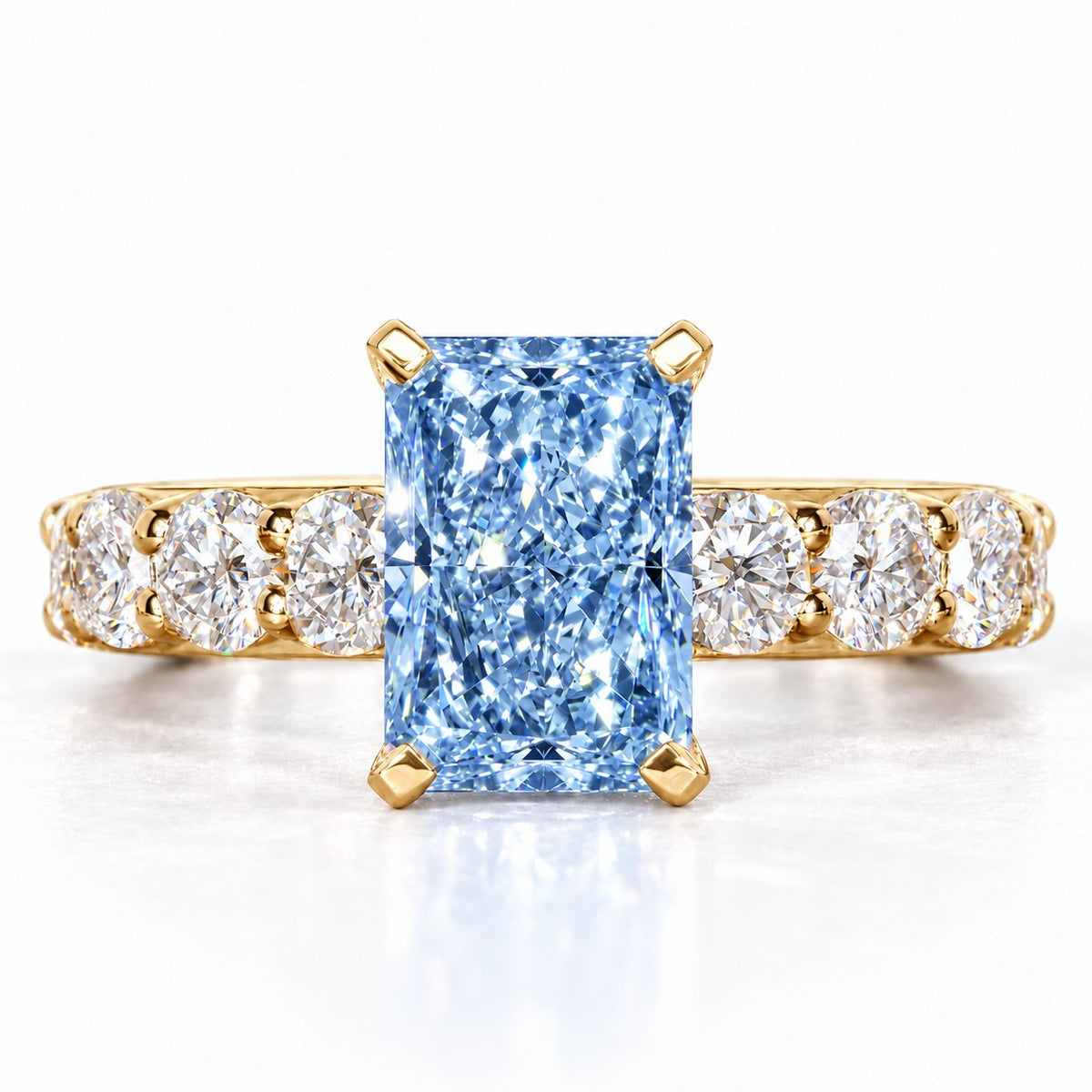 Blue Radiant Cut Lab Grown Diamond Engagement Ring - Shared Prong Band in yellow gold, front view