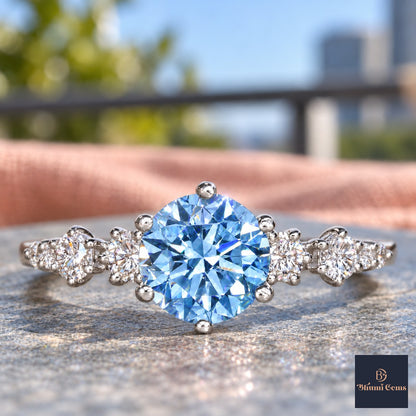 Blue Round Cut Lab Grown Diamond Engagement Ring - Cluster Shoulders in white gold, close-up