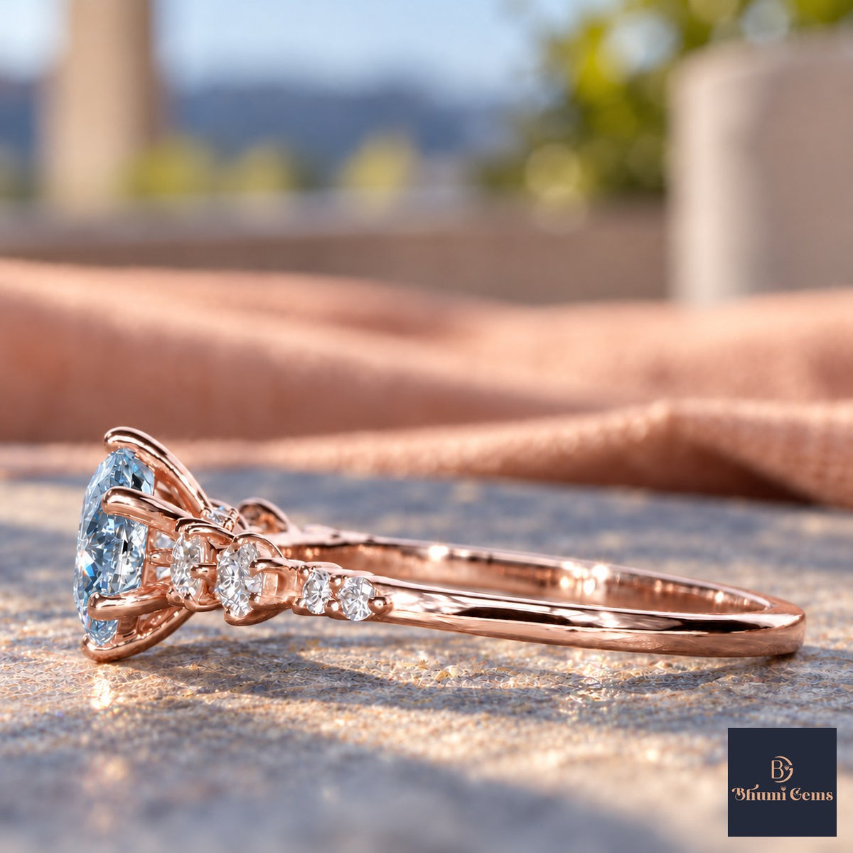 Blue Round Cut Lab Grown Diamond Engagement Ring - Cluster Shoulders in rose gold, side view