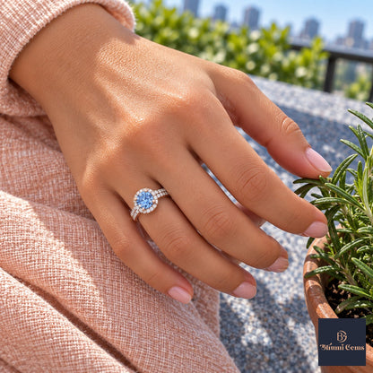 Blue Round Cut Lab Grown Diamond Engagement Ring - Halo Pave in rose gold, on the hand