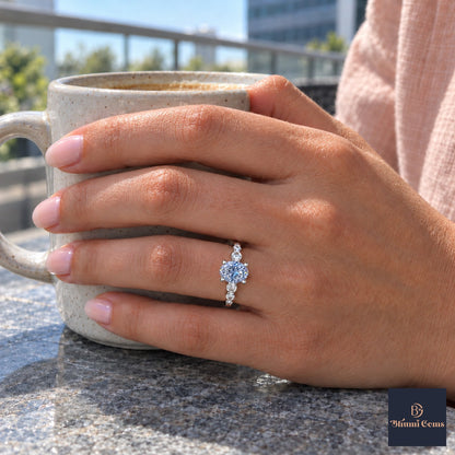 Blue Round Cut Lab Grown Diamond Engagement Ring - Marquise and Round Station Band in white gold, worn on the hand