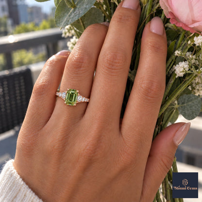 Green Emerald Cut Lab Grown Diamond Engagement Ring - Graduated Pave Shoulders in rose gold, worn on the hand
