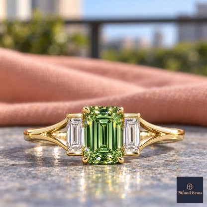 Green Emerald Cut Lab Grown Diamond Engagement Ring - Trapezoid Three Stone in yellow gold, close-up