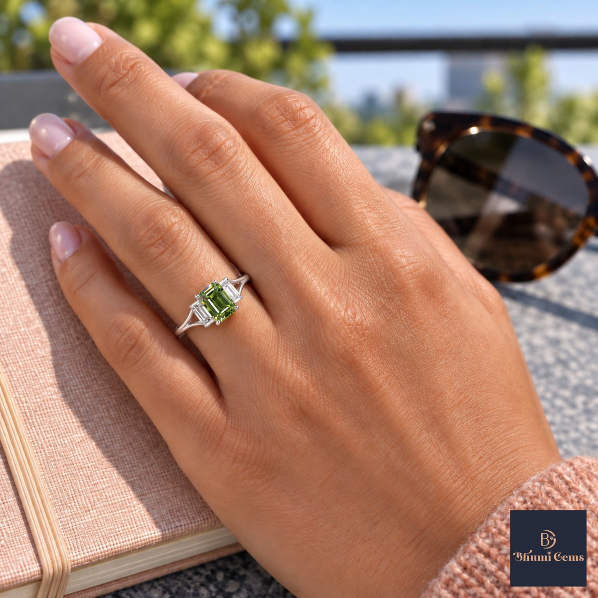 Green Emerald Cut Lab Grown Diamond Engagement Ring - Trapezoid Three Stone in white gold, worn on the hand