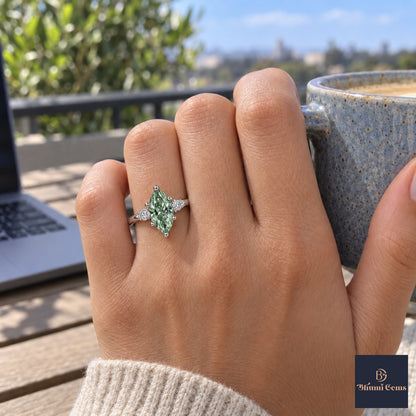 Green Marquise Cut Lab Grown Diamond Engagement Ring - Round Accents in white gold, on the hand