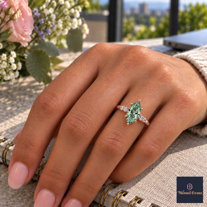 Green Marquise Cut Lab Grown Diamond Engagement Ring - Round Accents in rose gold, worn on the hand