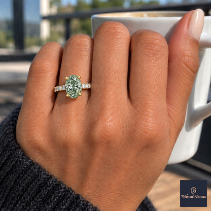 Green Oval Cut Lab Grown Diamond Engagement Ring - Cathedral Pave Band in yellow gold, on the hand