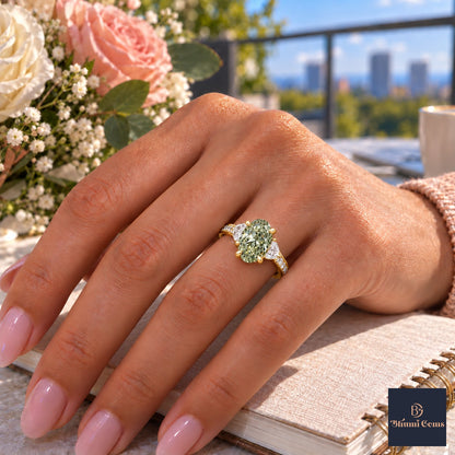 Green Oval Cut Lab Grown Diamond Engagement Ring - Half Moon Pave in yellow gold, worn on the hand