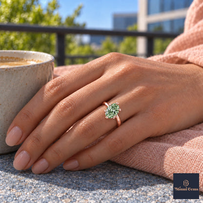 Green Oval Cut Lab Grown Diamond Engagement Ring - Heart Prong Solitaire in rose gold, on the hand