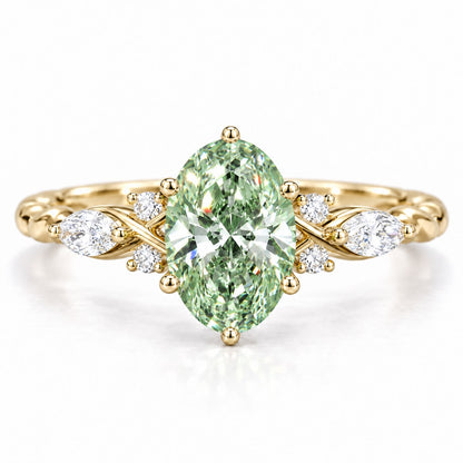 Green Oval Cut Lab Grown Diamond Engagement Ring - Leaf Cluster Shoulders in yellow gold, front view