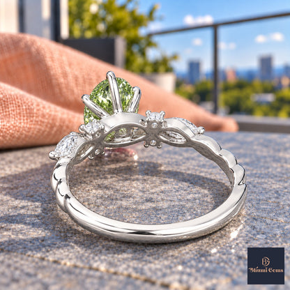 Green Oval Cut Lab Grown Diamond Engagement Ring - Leaf Cluster Shoulders in white gold, gallery view