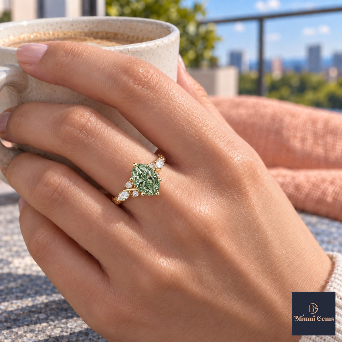 Green Oval Cut Lab Grown Diamond Engagement Ring - Leaf Cluster Shoulders in yellow gold, on the hand