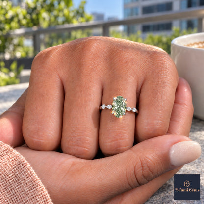 Green Oval Cut Lab Grown Diamond Engagement Ring - Marquise and Round Accents in white gold, on the hand