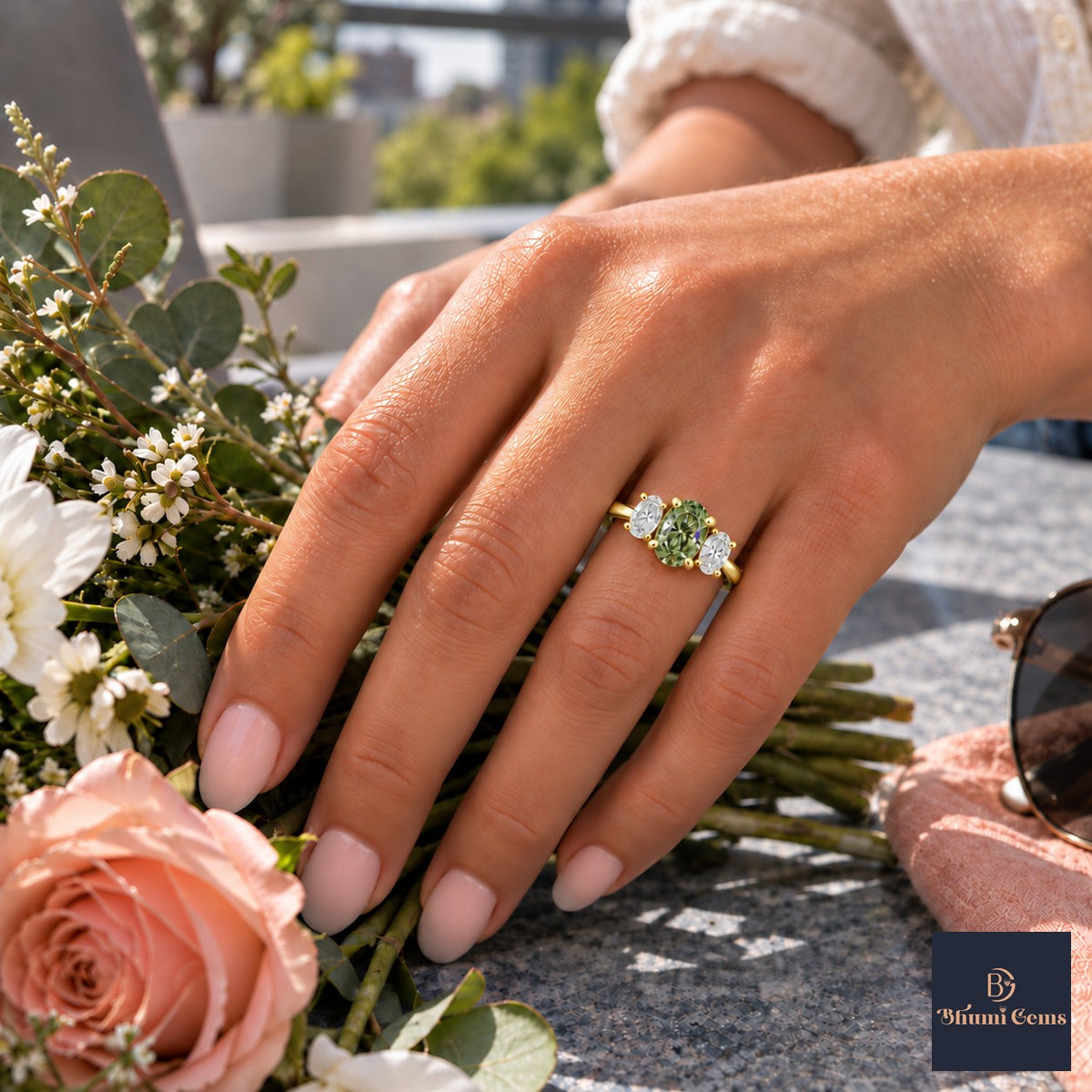 Green Oval Cut Lab Grown Diamond Engagement Ring - Oval Three Stone in yellow gold, worn on the hand