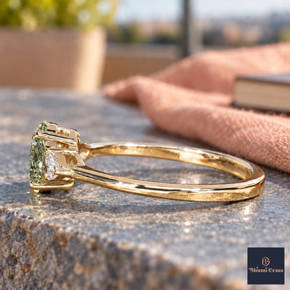 Green Oval Cut Lab Grown Diamond Engagement Ring - Pear Side Stones in yellow gold, side view