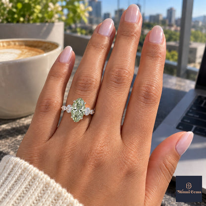 Green Oval Cut Lab Grown Diamond Engagement Ring - Round and Marquise Accents in white gold, on the hand