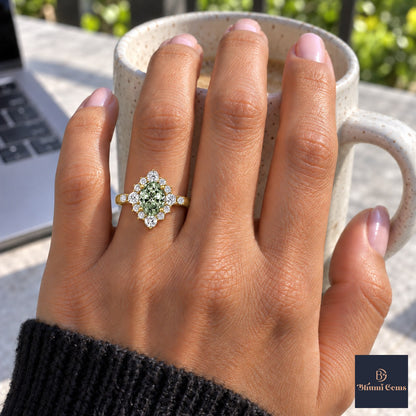 Green Oval Cut Lab Grown Diamond Engagement Ring - Scalloped Halo in yellow gold, on the hand