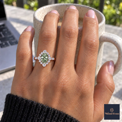 Green Oval Cut Lab Grown Diamond Engagement Ring - Scalloped Halo in rose gold, on the hand