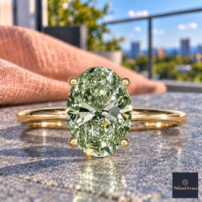 Green Oval Cut Lab Grown Diamond Engagement Ring - Six Prong Solitaire in yellow gold, close-up
