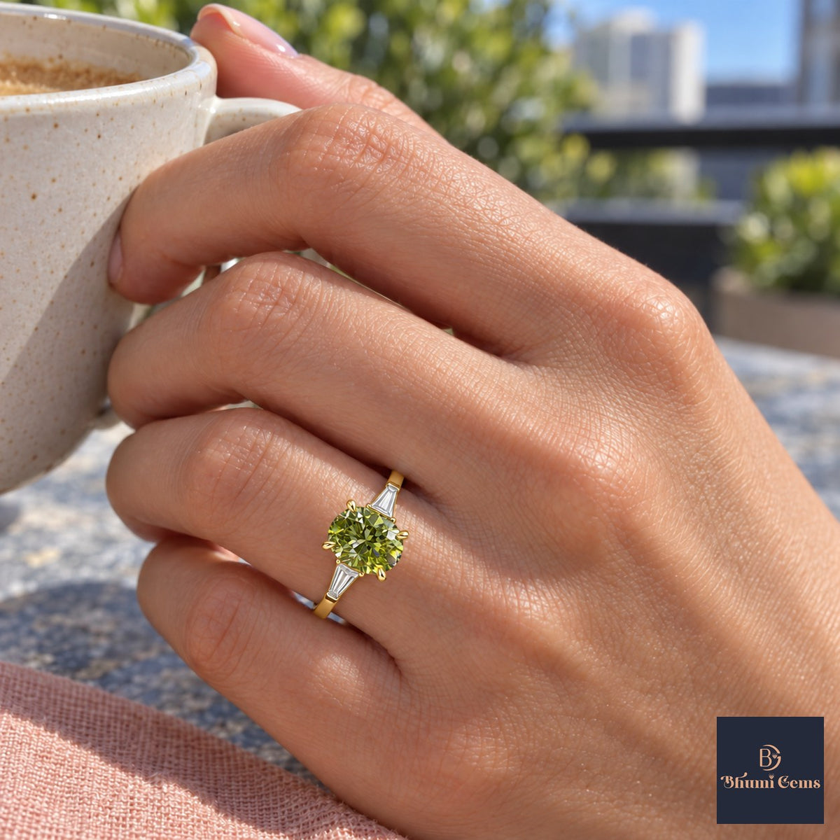 Green Oval Cut Lab Grown Diamond Engagement Ring - Tapered Baguettes in yellow gold, on the hand