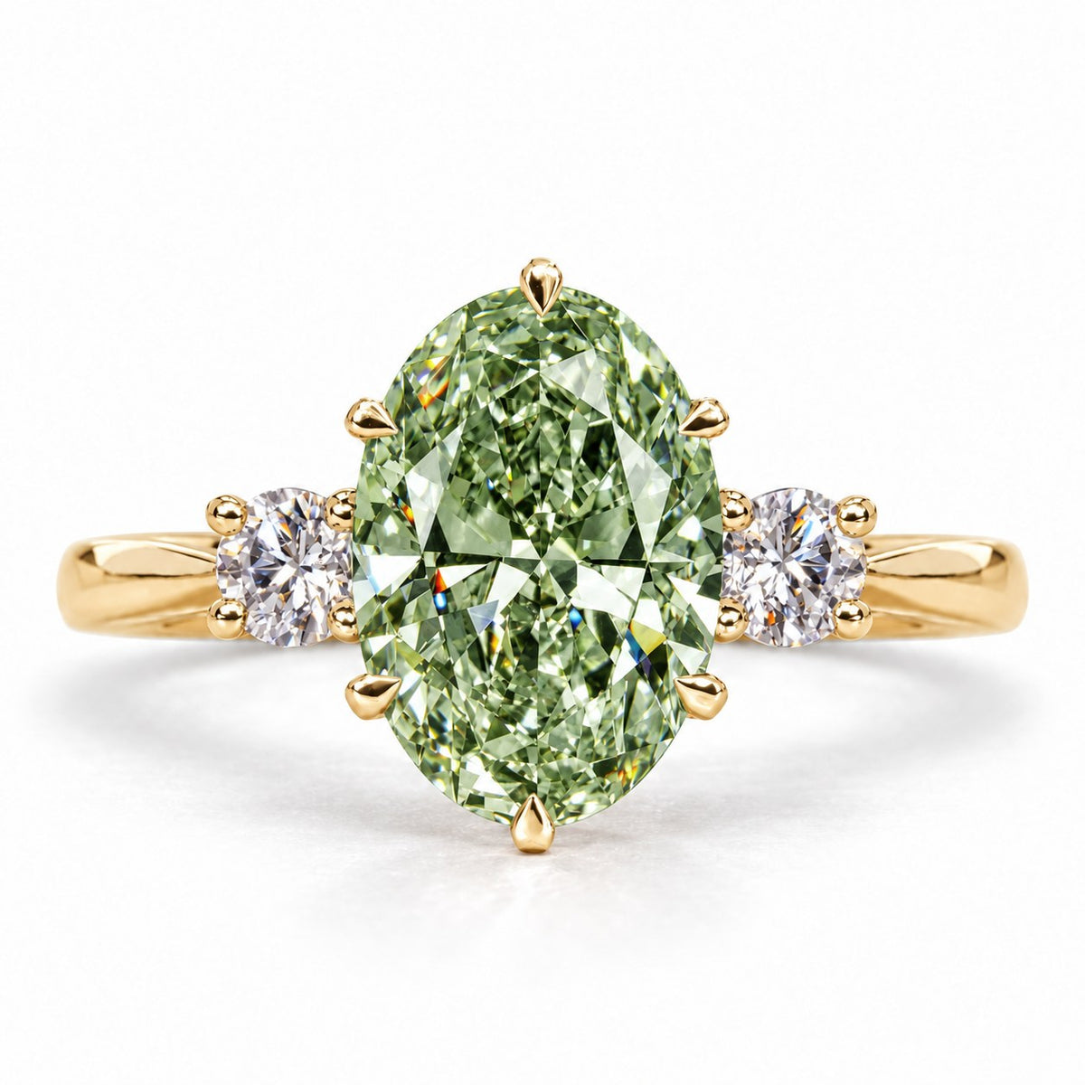 Green Oval Cut Lab Grown Diamond Engagement Ring - Three Stone in yellow gold, front view