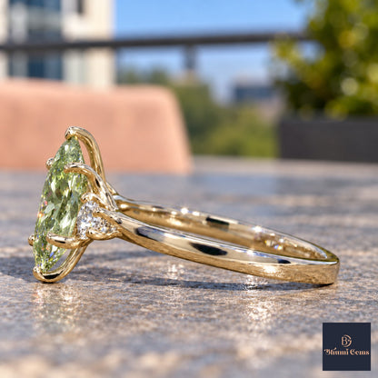 Green Oval Cut Lab Grown Diamond Engagement Ring - Three Stone in yellow gold, side view