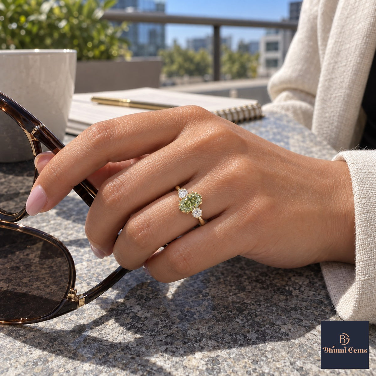Green Oval Cut Lab Grown Diamond Engagement Ring - Three Stone in yellow gold, on the hand