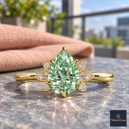 Green Pear Cut Lab Grown Diamond Engagement Ring - Floral Leaf Accents in yellow gold, close-up