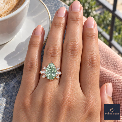 Green Pear Cut Lab Grown Diamond Engagement Ring - Floral Leaf Accents in rose gold, on the hand