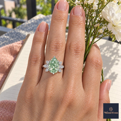 Green Pear Cut Lab Grown Diamond Engagement Ring - Floral Leaf Accents in white gold, worn on the hand