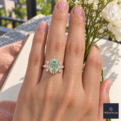 Green Pear Cut Lab Grown Diamond Engagement Ring - Floral Leaf Accents in rose gold, worn on the hand