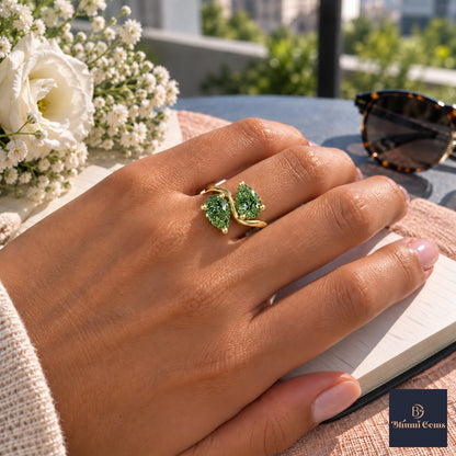 Green Pear Cut Lab Grown Diamond Engagement Ring - Toi et Moi in yellow gold, worn on the hand