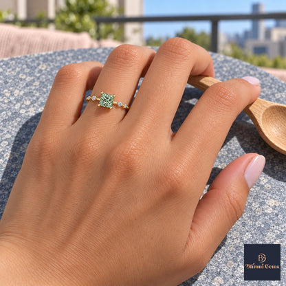 Green Princess Cut Lab Grown Diamond Engagement Ring - Station Band in yellow gold, worn on the hand