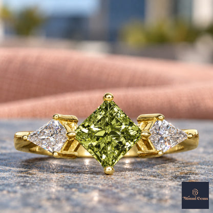 Green Princess Cut Lab Grown Diamond Engagement Ring - Trillion Three Stone in yellow gold, close-up