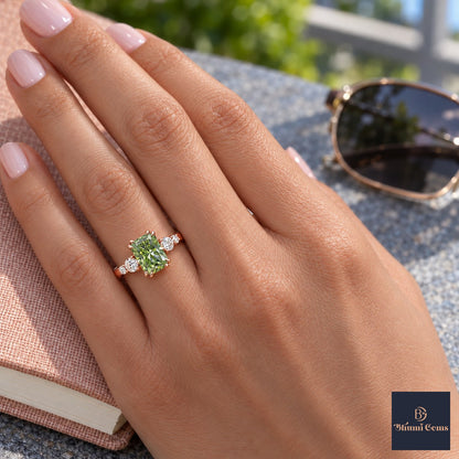 Green Radiant Cut Lab Grown Diamond Engagement Ring - Round Accents in rose gold, worn on the hand