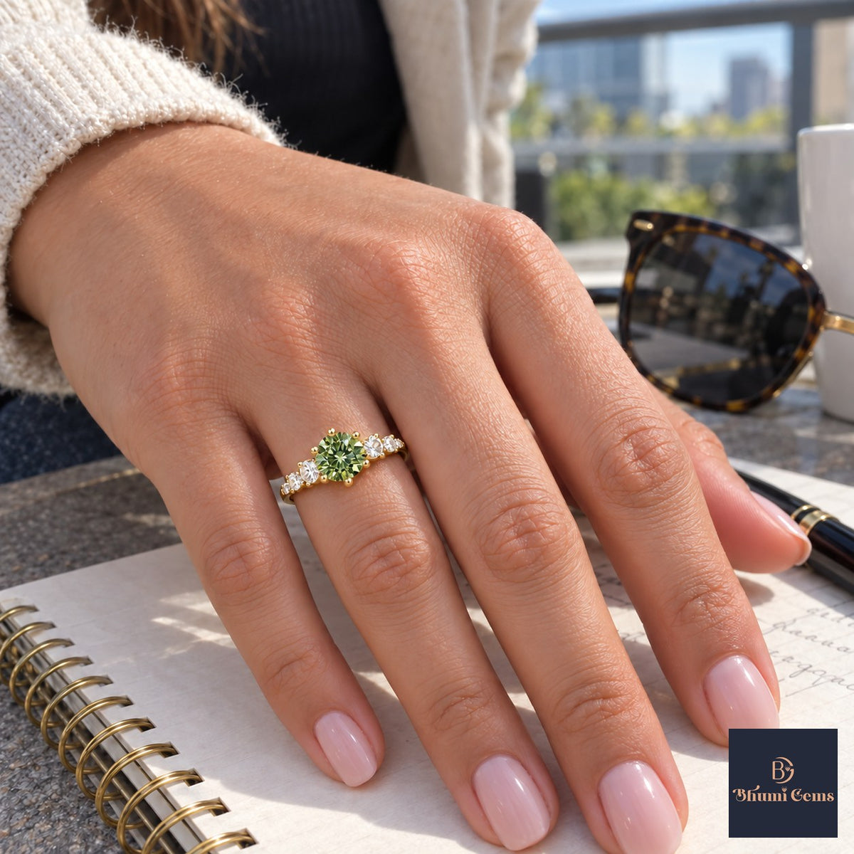 Green Round Cut Lab Grown Diamond Engagement Ring - Cluster Shoulders in yellow gold, worn on the hand
