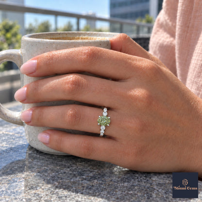 Green Round Cut Lab Grown Diamond Engagement Ring - Marquise and Round Station Band in white gold, worn on the hand