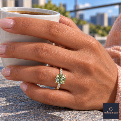 Green Round Cut Lab Grown Diamond Engagement Ring - Pave Shoulders in yellow gold, on the hand