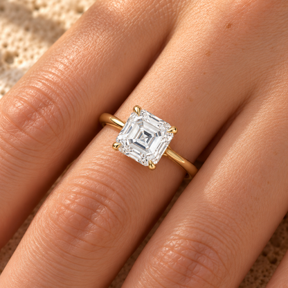 Asscher cut lab grown diamond cathedral ring worn on hand, yellow gold